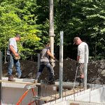 Niki doing the pour. Tough work, especially on a 2 x 10 scaffolding.